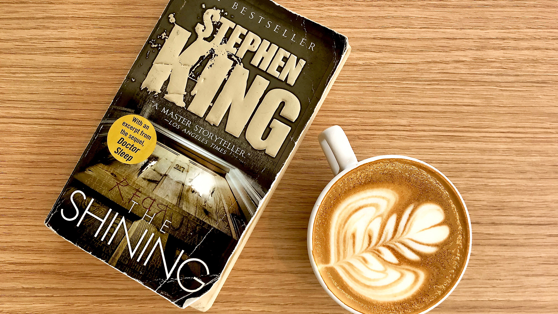 Caffeinated Curation featuring Stephen King's "The Shining" and a cappuccino by Blueprint Coffee at High Low in Grand Center, St. Louis